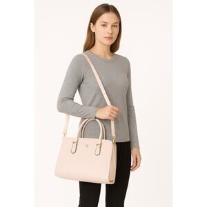 Large Beige Handbag.  Feet on bottom, textured surface.  Dome shape crossbody